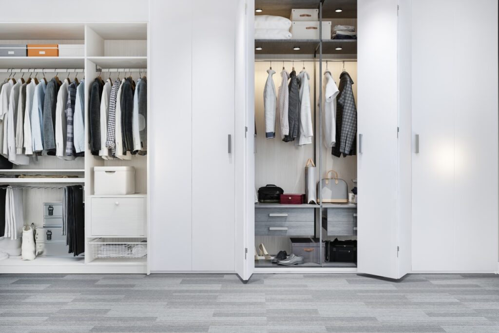 Battery-powered puck lights illuminating a closet shelf